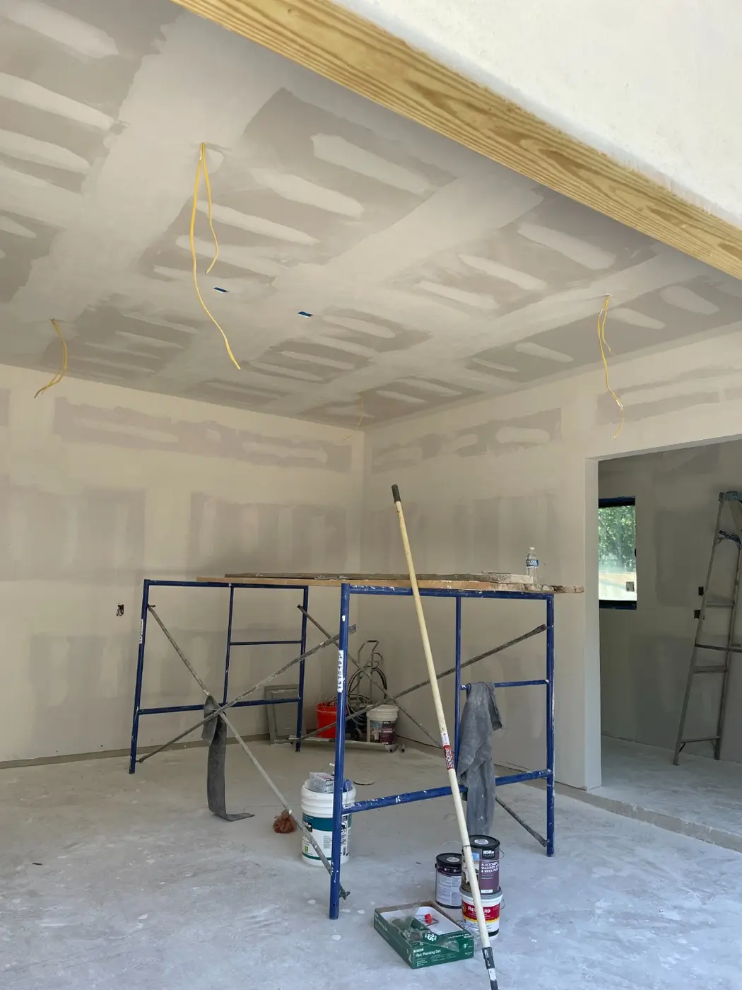 Finished drywall and texture inside the casita with wiring still hanging