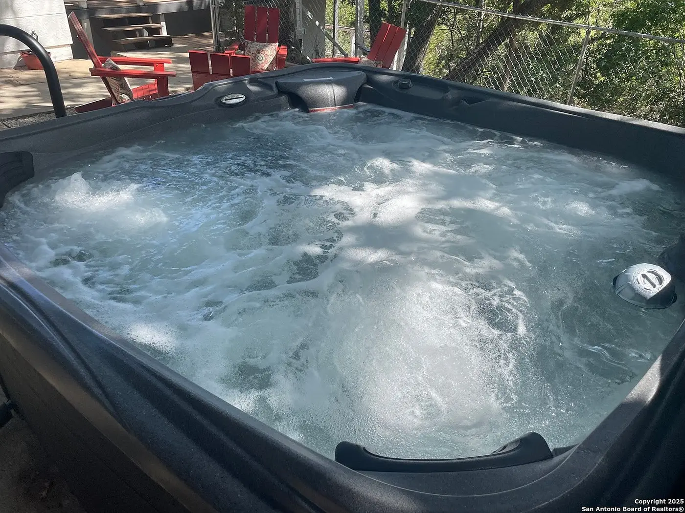 After: the new hot tub bubbling and running perfectly on its pad